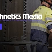 image: a construction worker uses a massive power drill to secure rivets - text: Technetics Media, play